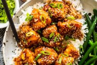 Air Fryer Honey Sesame Chicken with Crispy Sticky Glaze