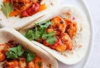 Crispy Shrimp Tacos with Lime Slaw and Avocado Crema