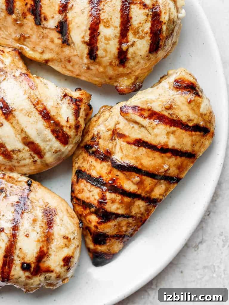 How to Grill Juicy Chicken Every Time 2 chicken breast on plate.