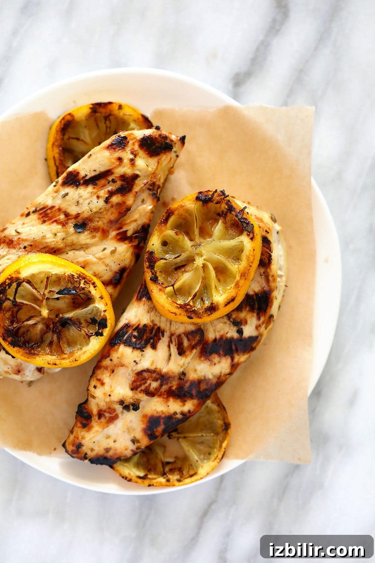 Greek Chicken Marinade with Lemon and Oregano 2 grilled Greek chicken on plate