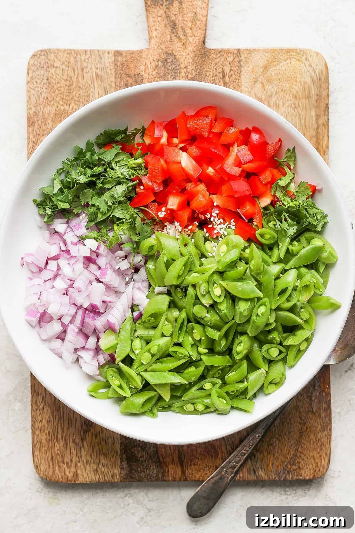 Ginger pea salad ingredients in a bowl.