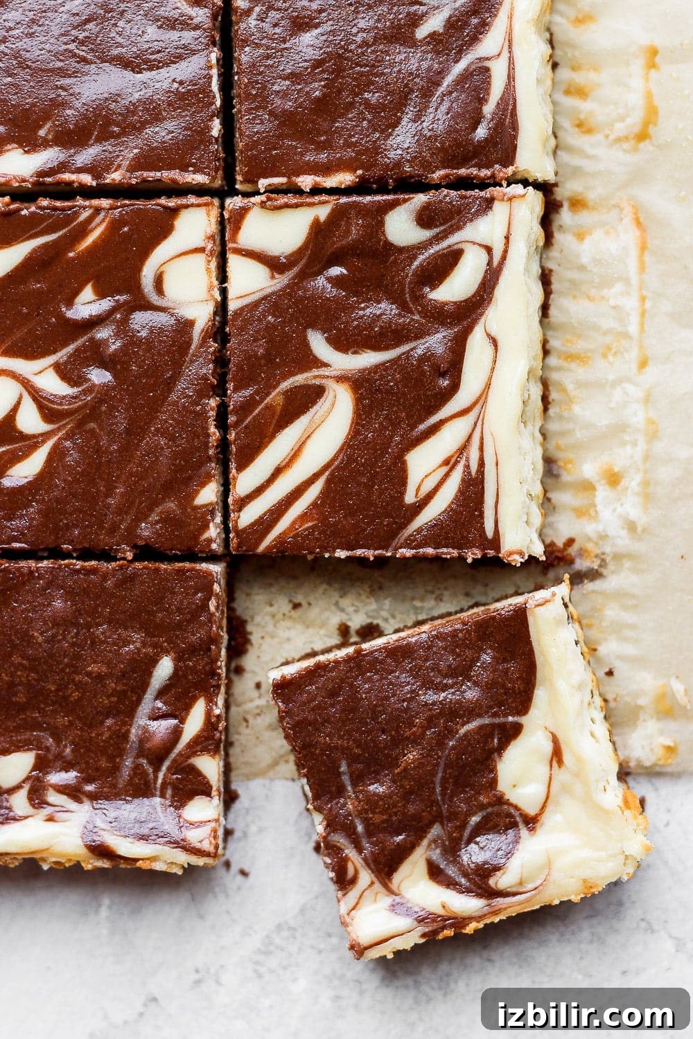 Cheesecake bars in a pan.