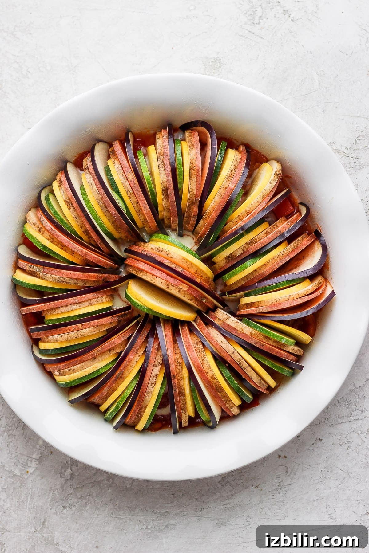 Authentic French Ratatouille Recipe 4 Vegetables for ratatouille in a baking dish.