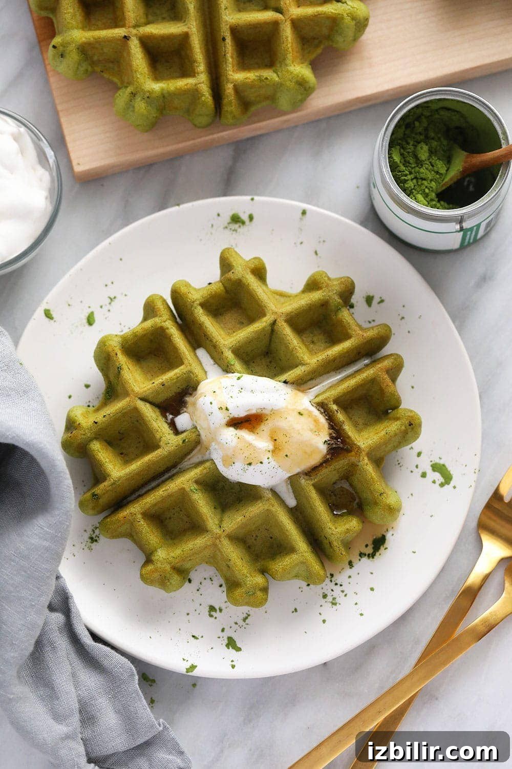 Gluten-Free Matcha Waffles Recipe 5 matcha waffle on plate with coconut whipped cream