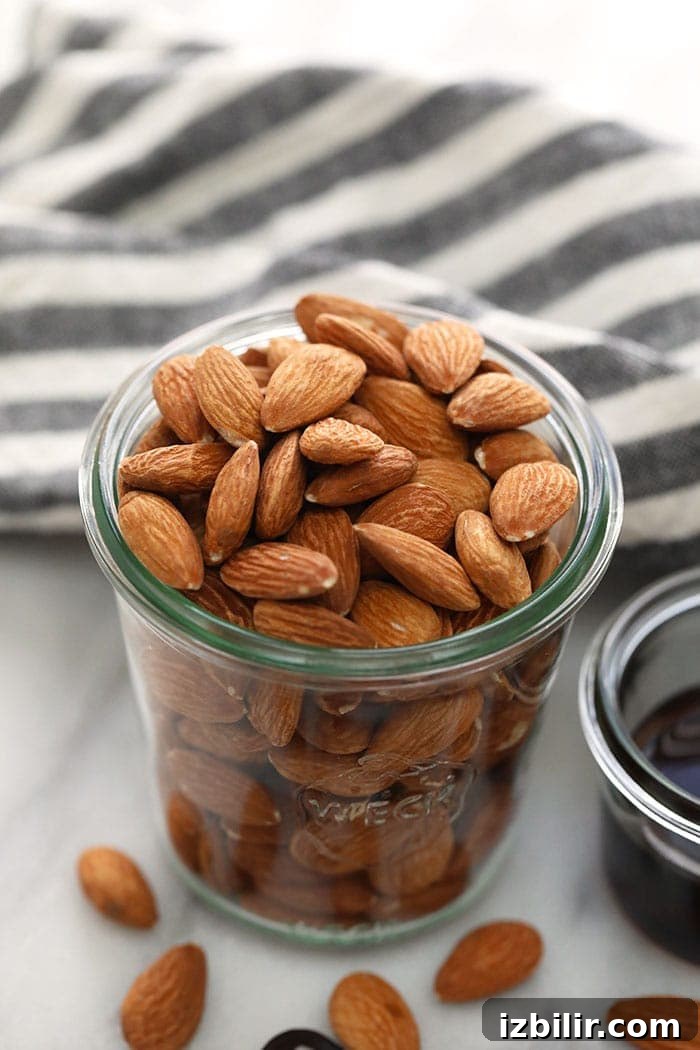almonds in a jar ready to be roasted for almond butter.
