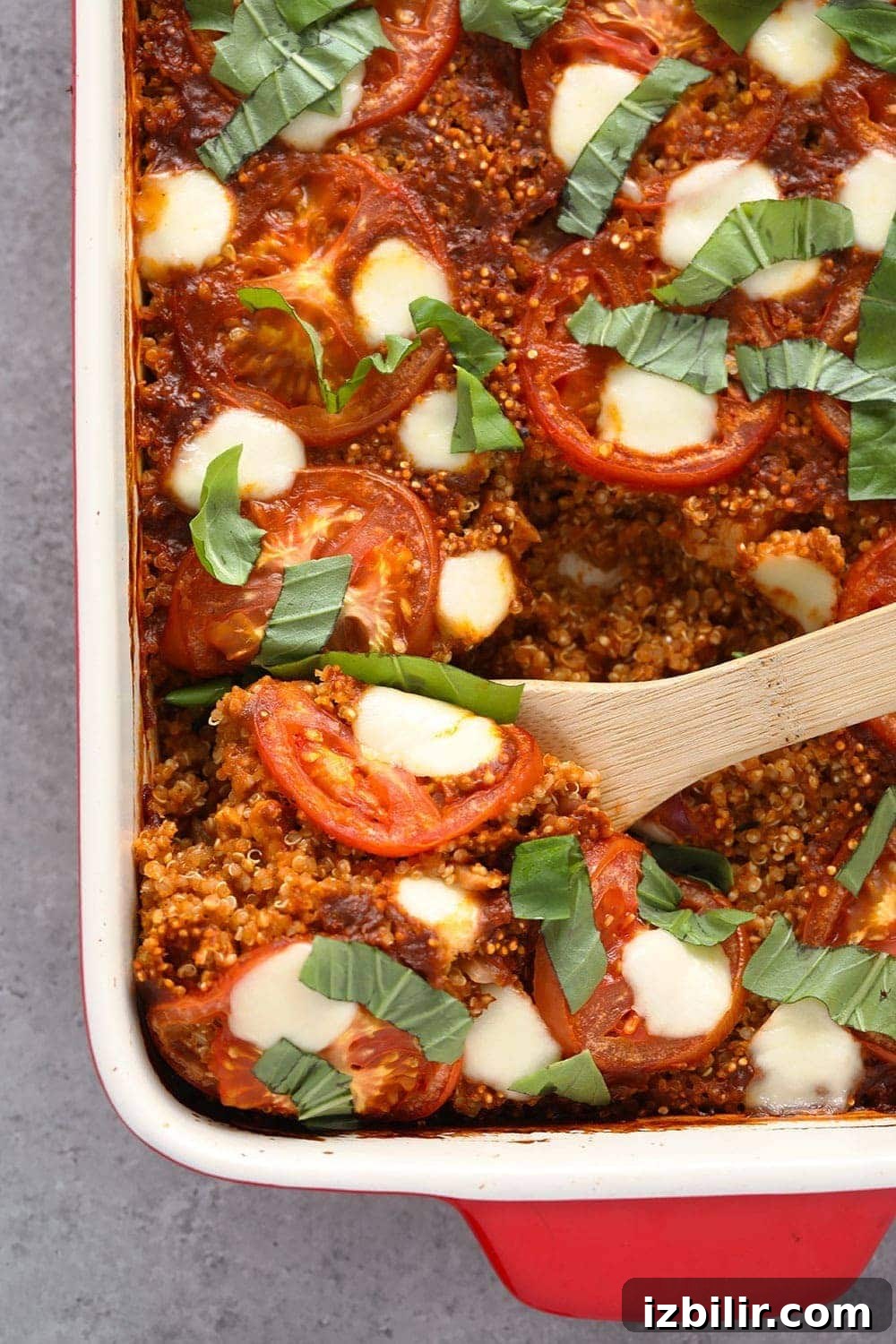 Tuscan chicken quinoa casserole with tomatoes, mozzarella and fresh basil