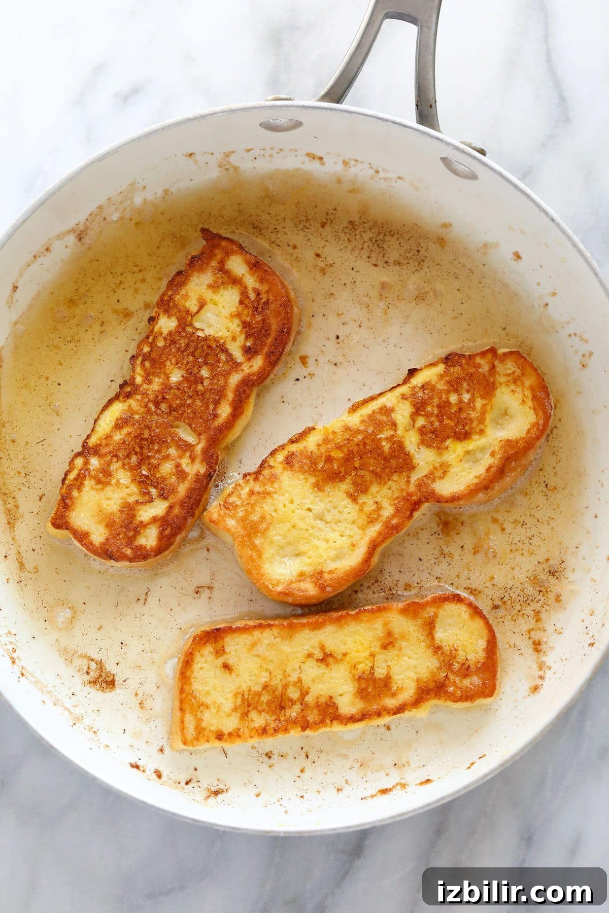 Cooking French toast sticks in a pan