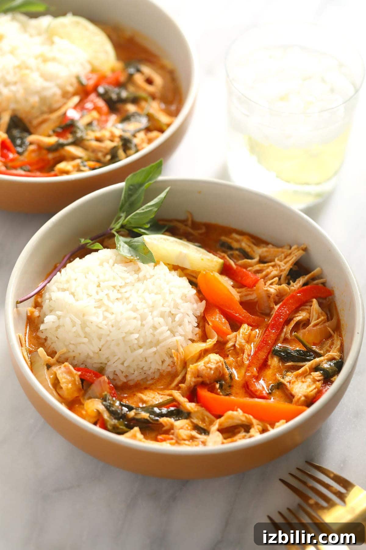 Instant Pot Thai Coconut Curry Chicken coconut curry in bowl with forks