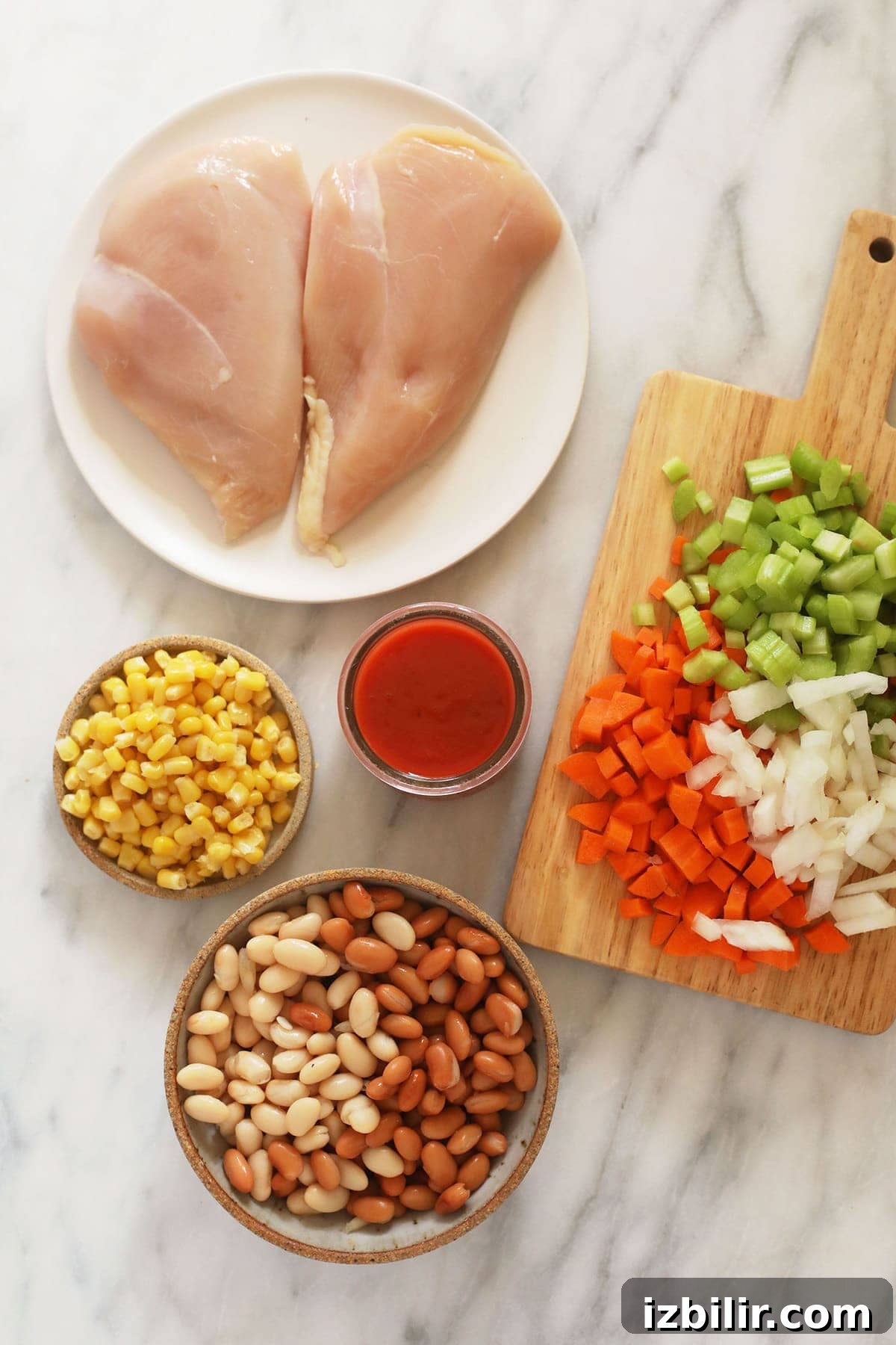 Ingredients for Instant Pot Buffalo Chicken Chili. chili ingredients on cutting board