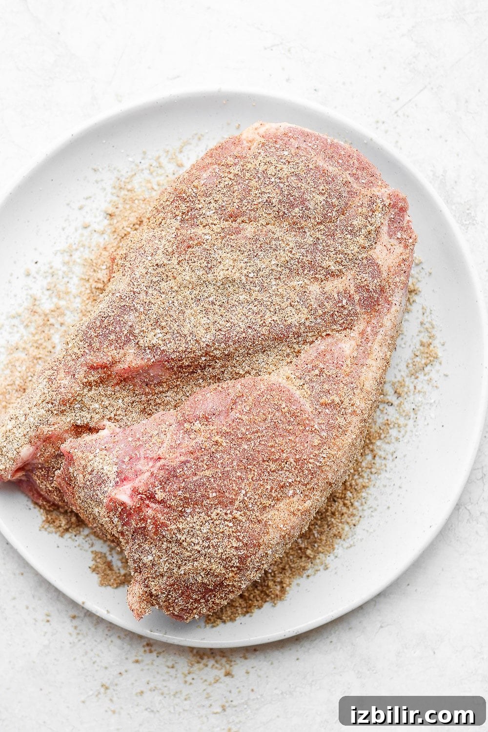 pork shoulder patted with dry rub