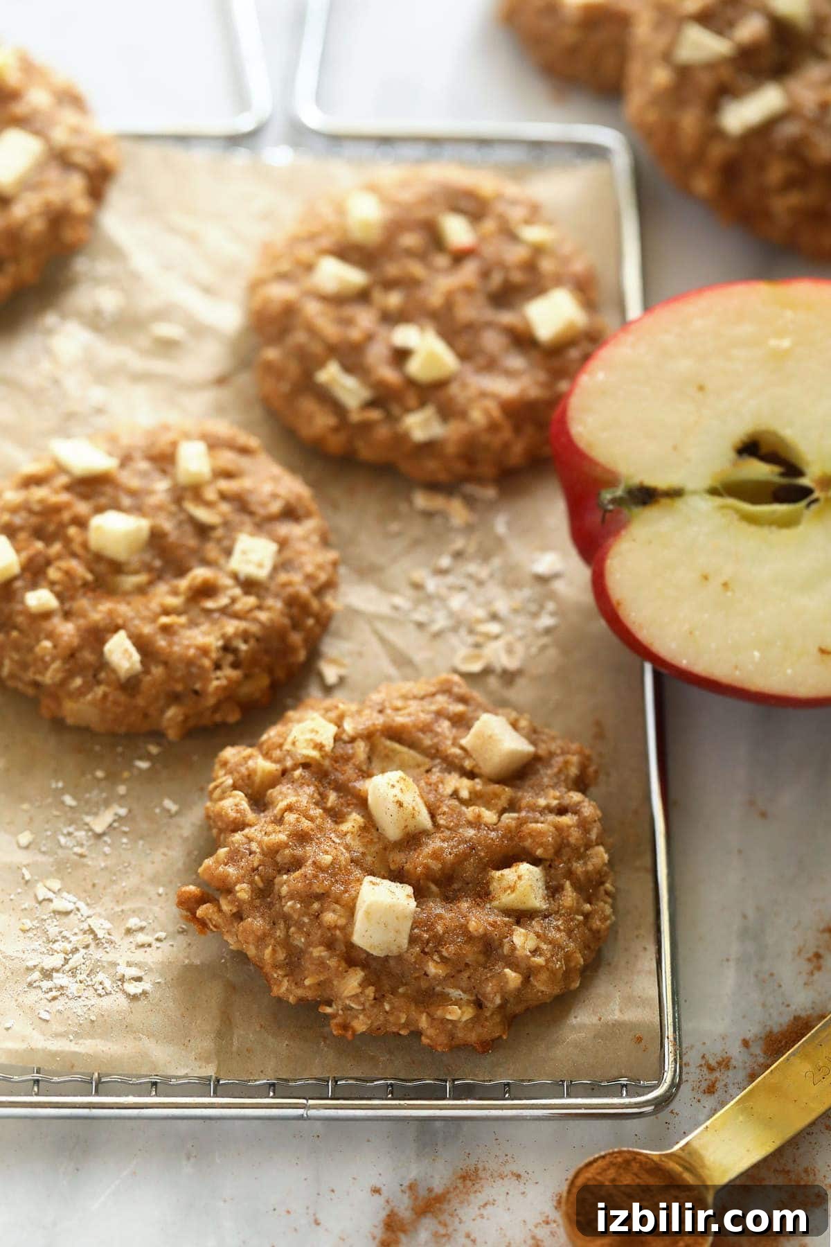 Soft Chewy Apple Oatmeal Cookies with Cinnamon 2 Apple oatmeal cookies on a cooling rack.