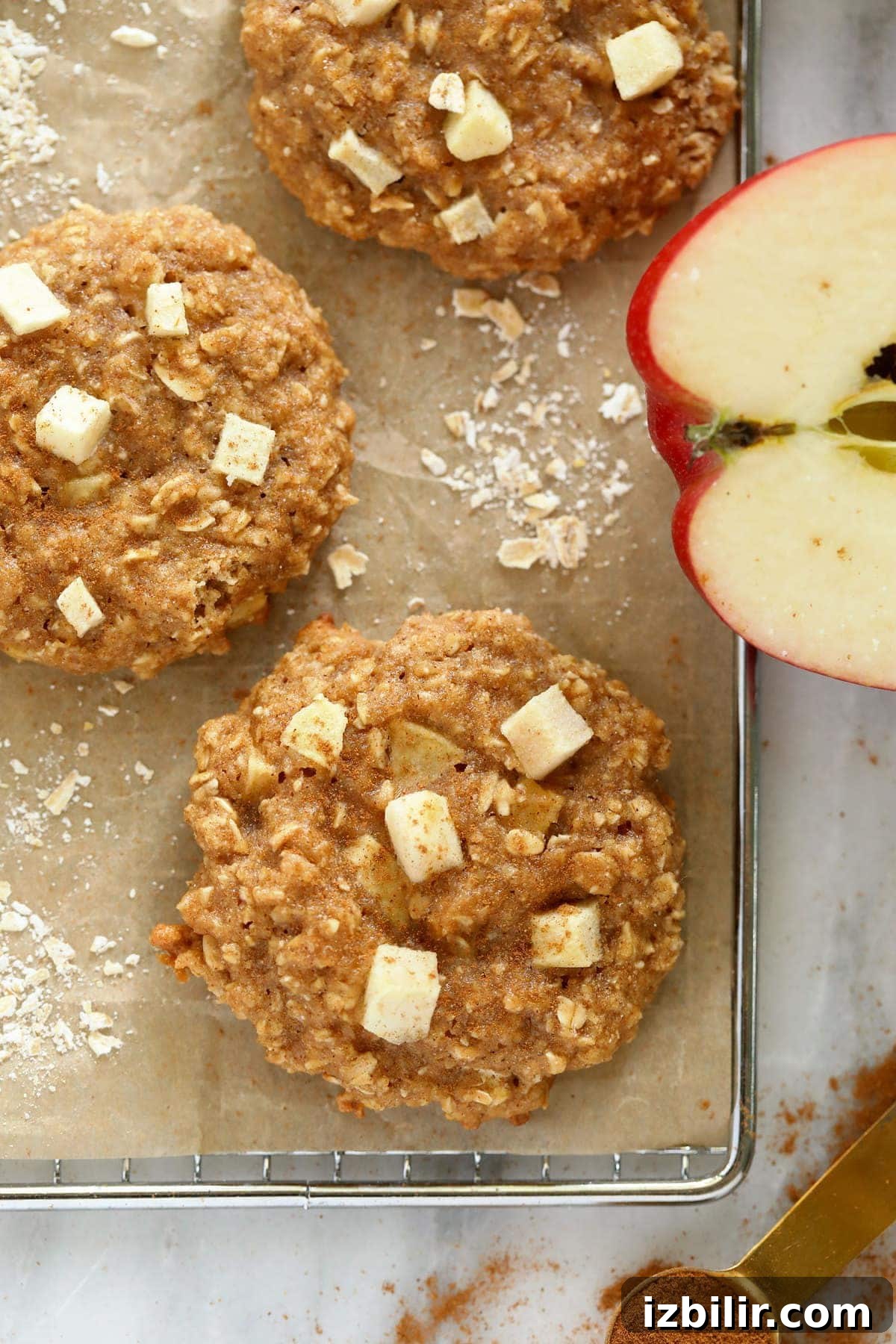 Soft Chewy Apple Oatmeal Cookies with Cinnamon 6 Baked apple oatmeal cookies on a cooling rack.