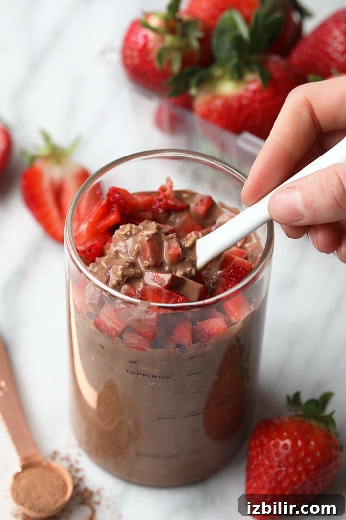 Jars of overnight oats with strawberries
