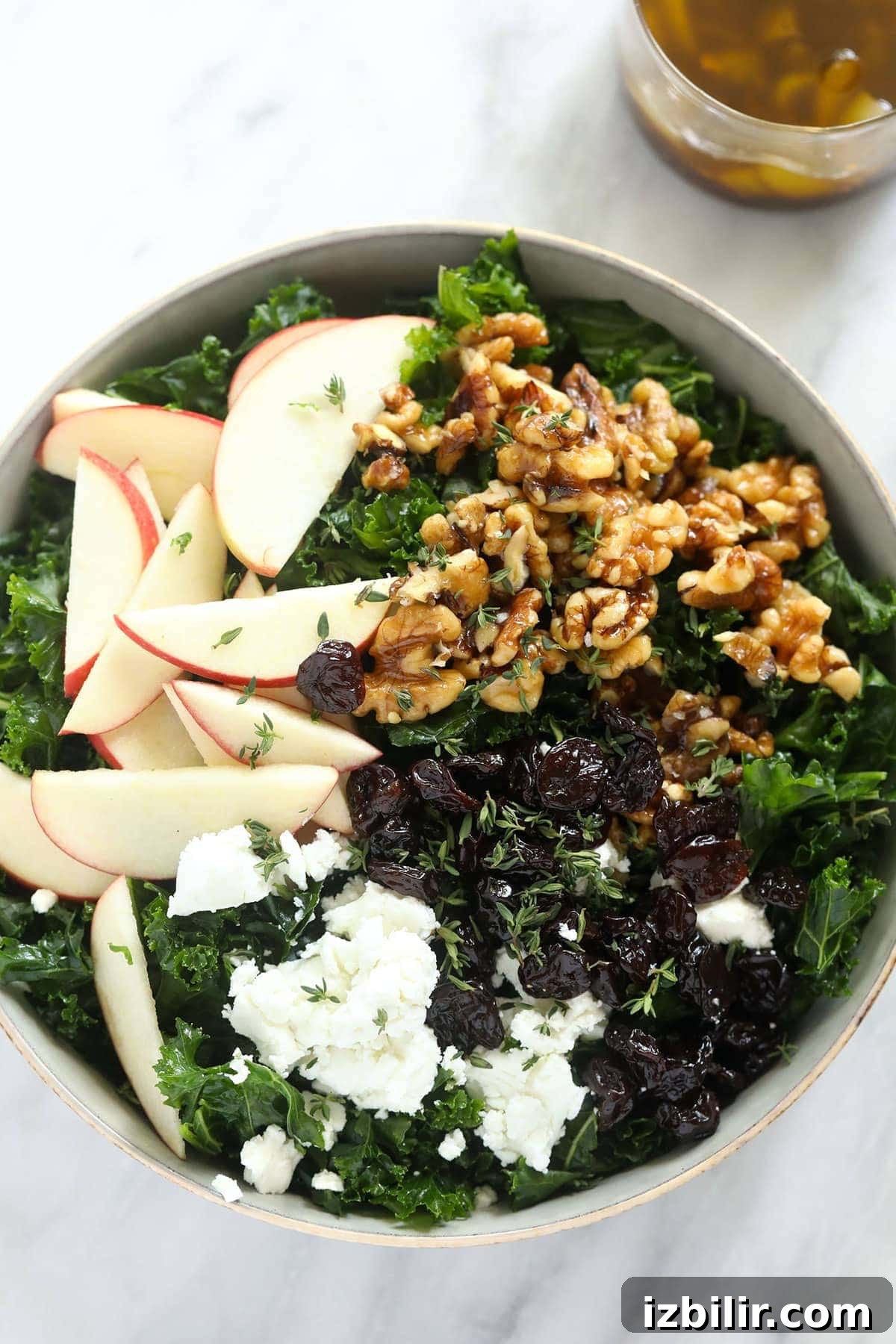 Thanksgiving salad with kale, apples, and walnuts Thanksgiving salad in bowl with apples