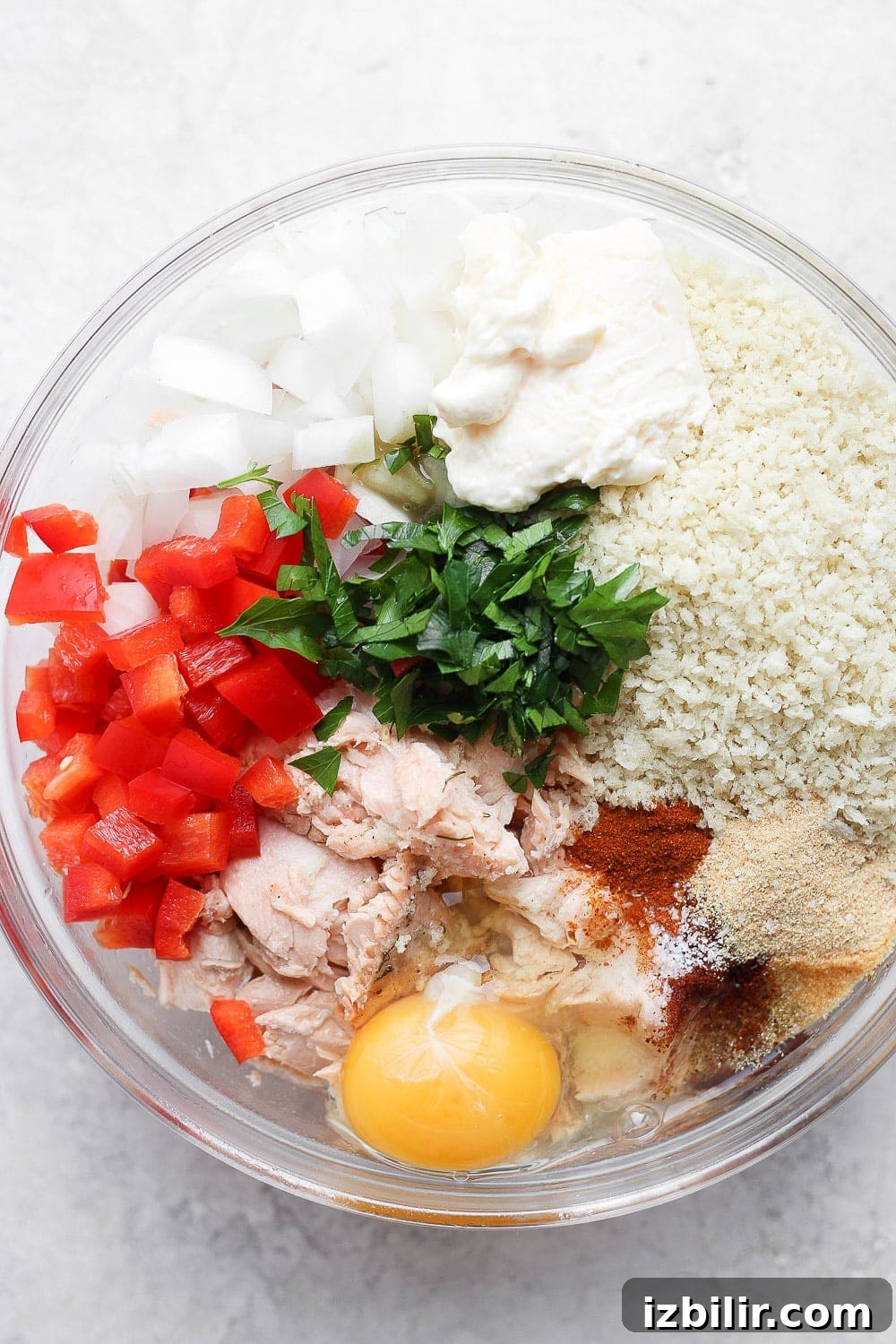 Salmon patties ingredients mixed in a bowl salmon patties ingredients in a bowl ready to be mixed