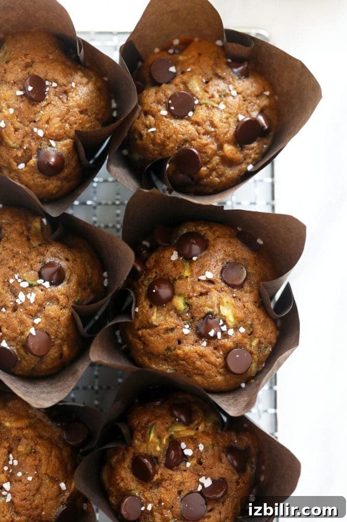 zucchini muffins on wire rack.
