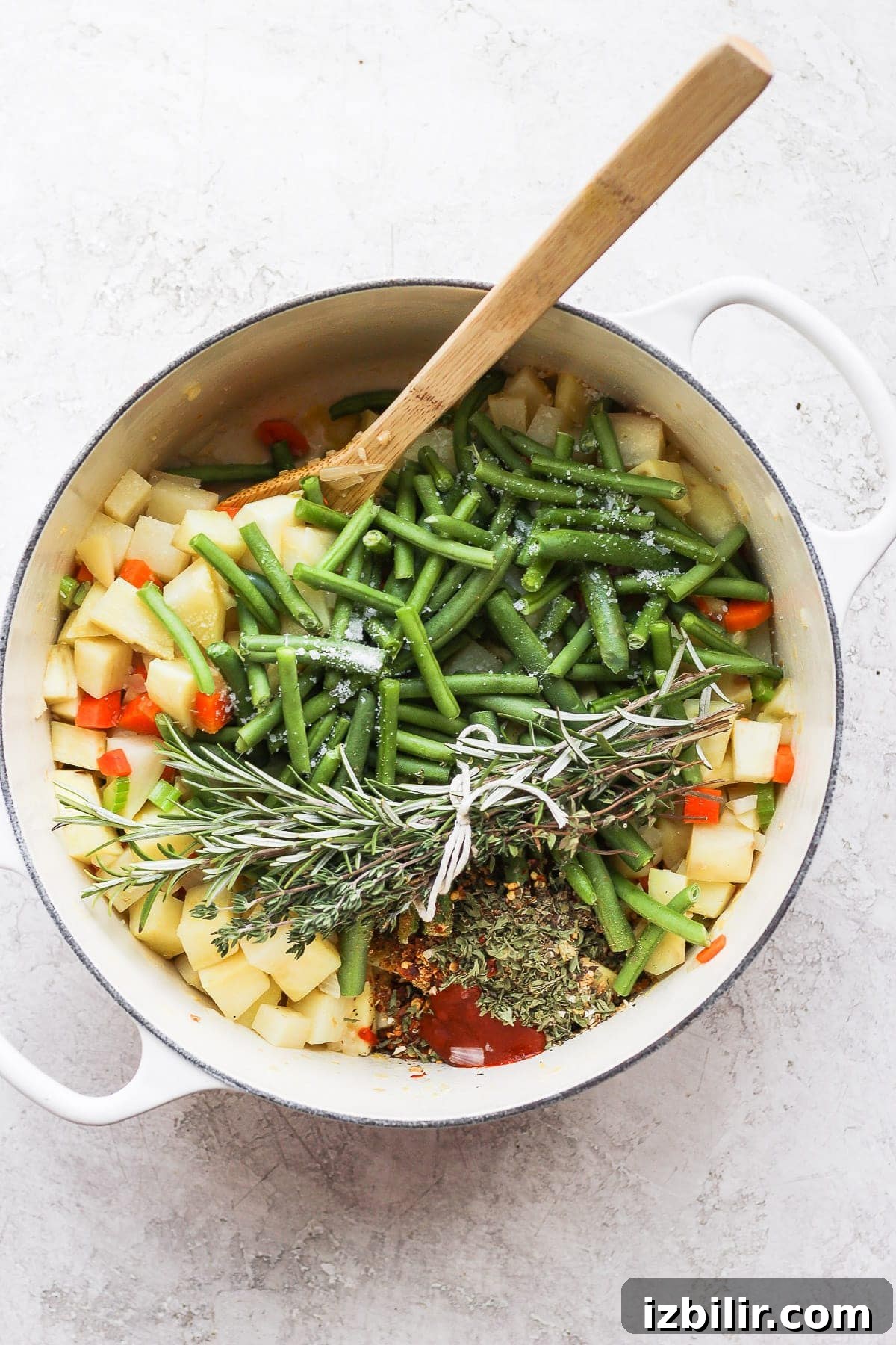 All the ingredients for vegetable soup in a Dutch oven.