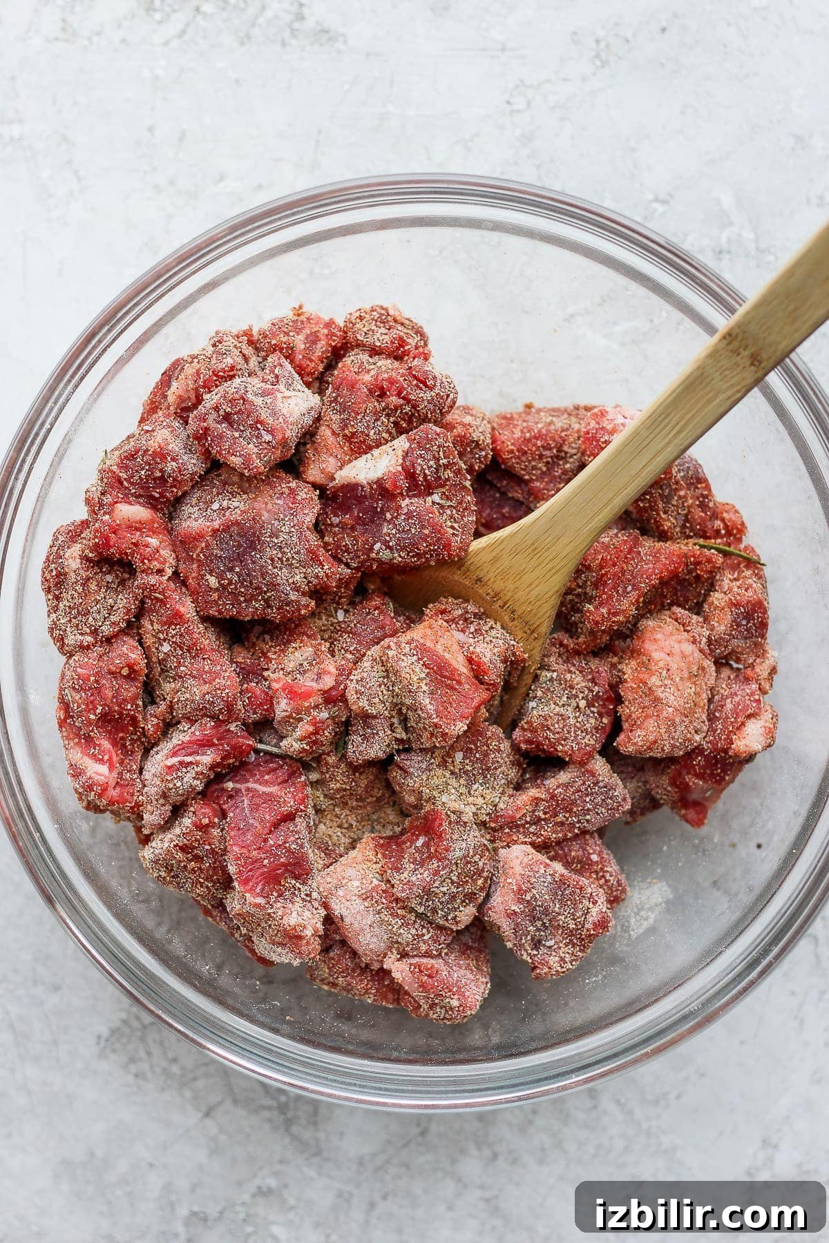 Seasoned beef before browning Instant Pot beef stew meat seasoned and ready to be browned