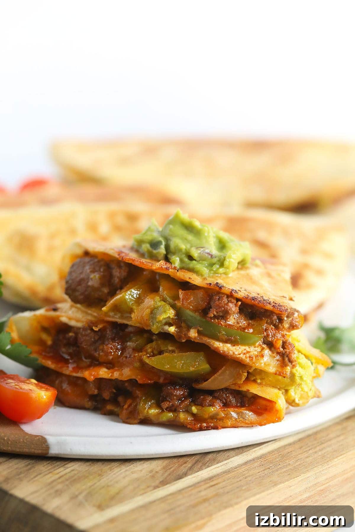 chicken quesadilla topped with guacamole