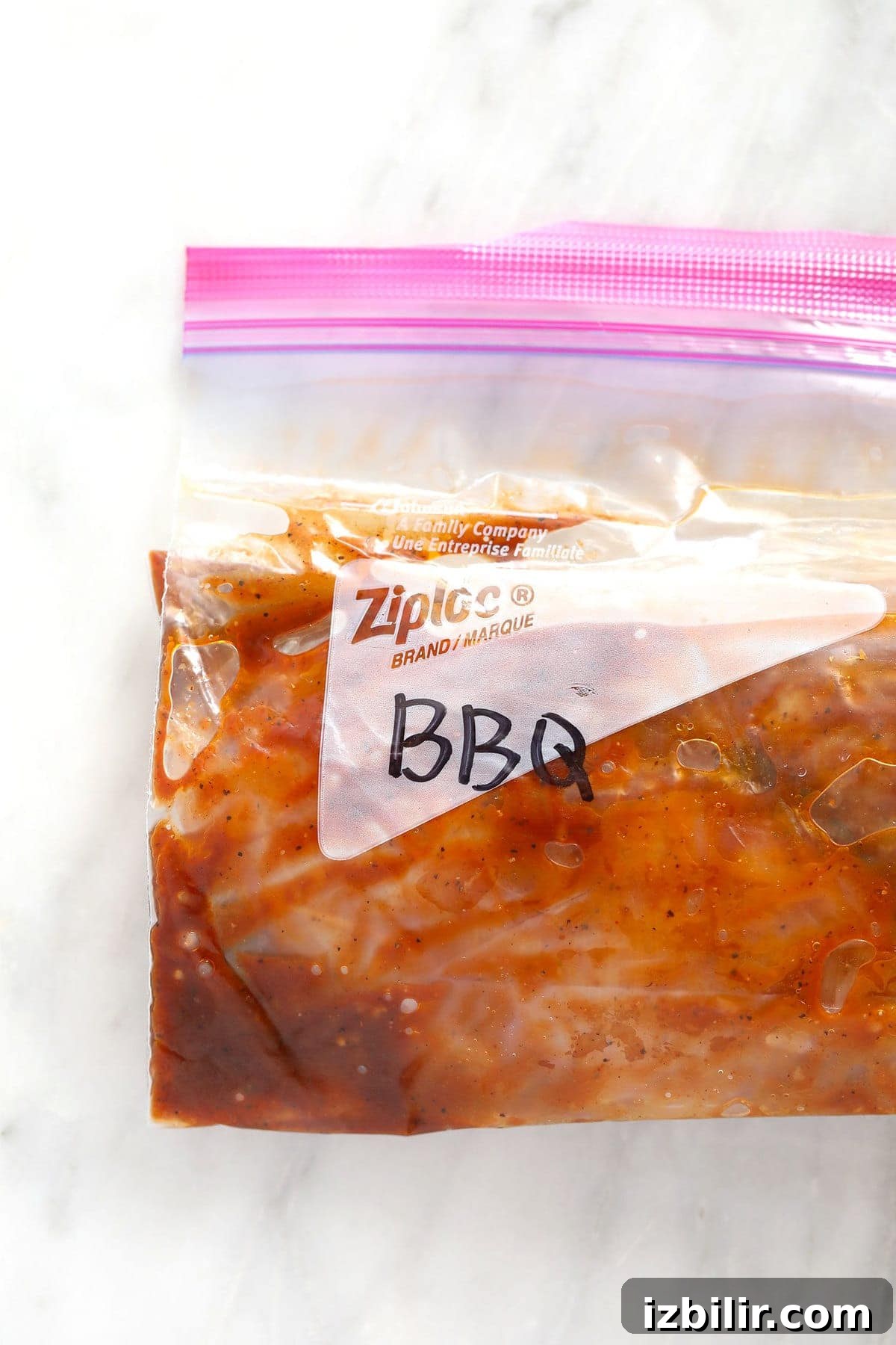 BBQ chicken marinating in a ziploc bag