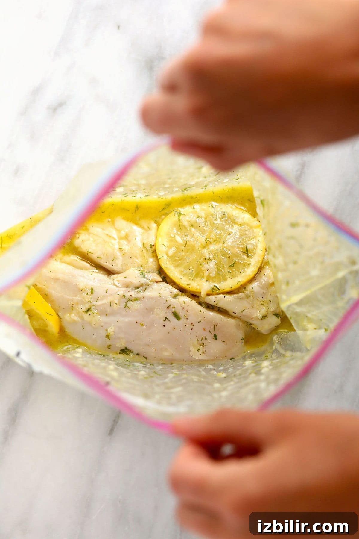 lemon chicken marinating in a gallon size bag