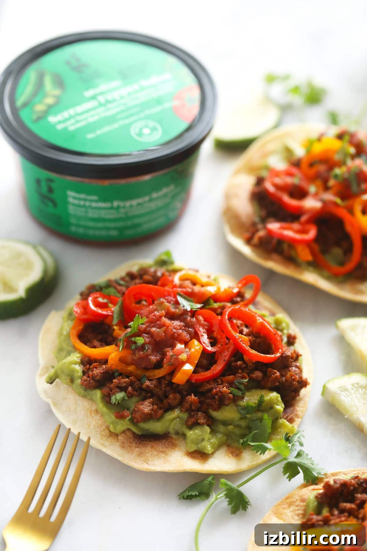 Vegetarian tostadas with guacamole and peppers tostada with guacamole, plant based ground, and mini sweet peppers
