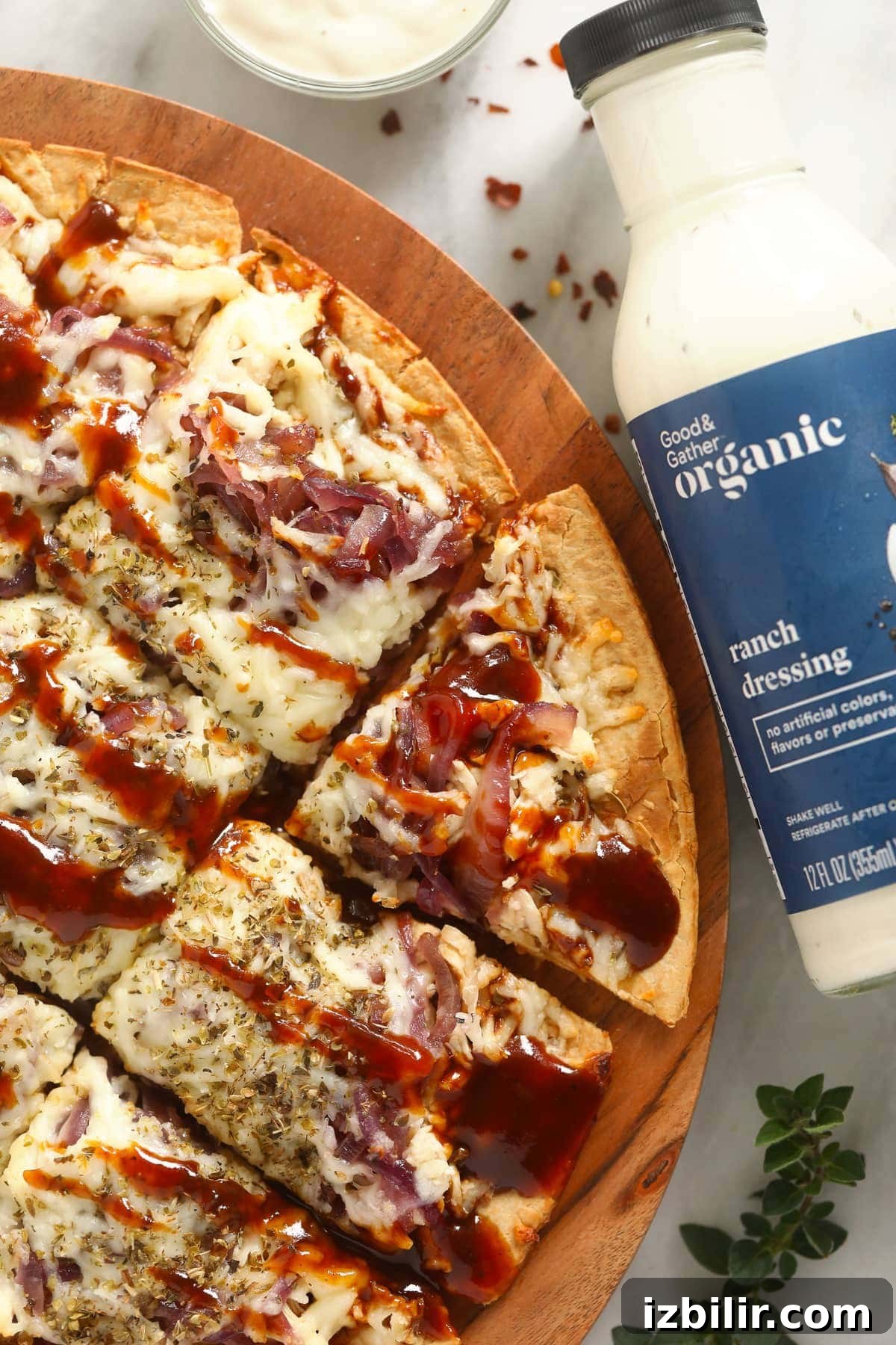 bbq chicken pizza on cutting board