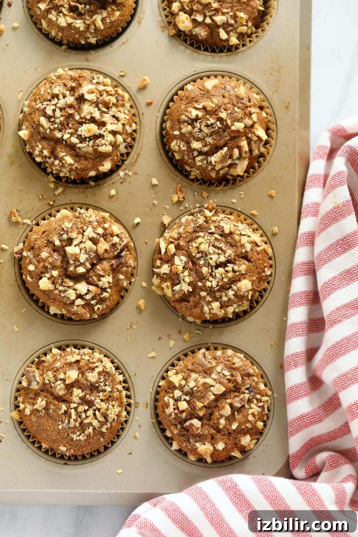Banana nut muffins in a muffin tin.