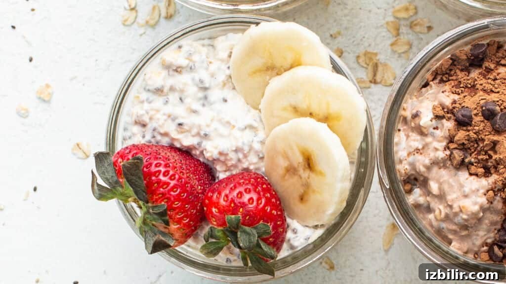 Three jars of oatmeal with chocolate chips, bananas and strawberries.
