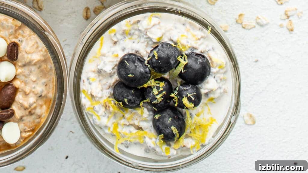 Three jars of oatmeal with black olives and almonds.