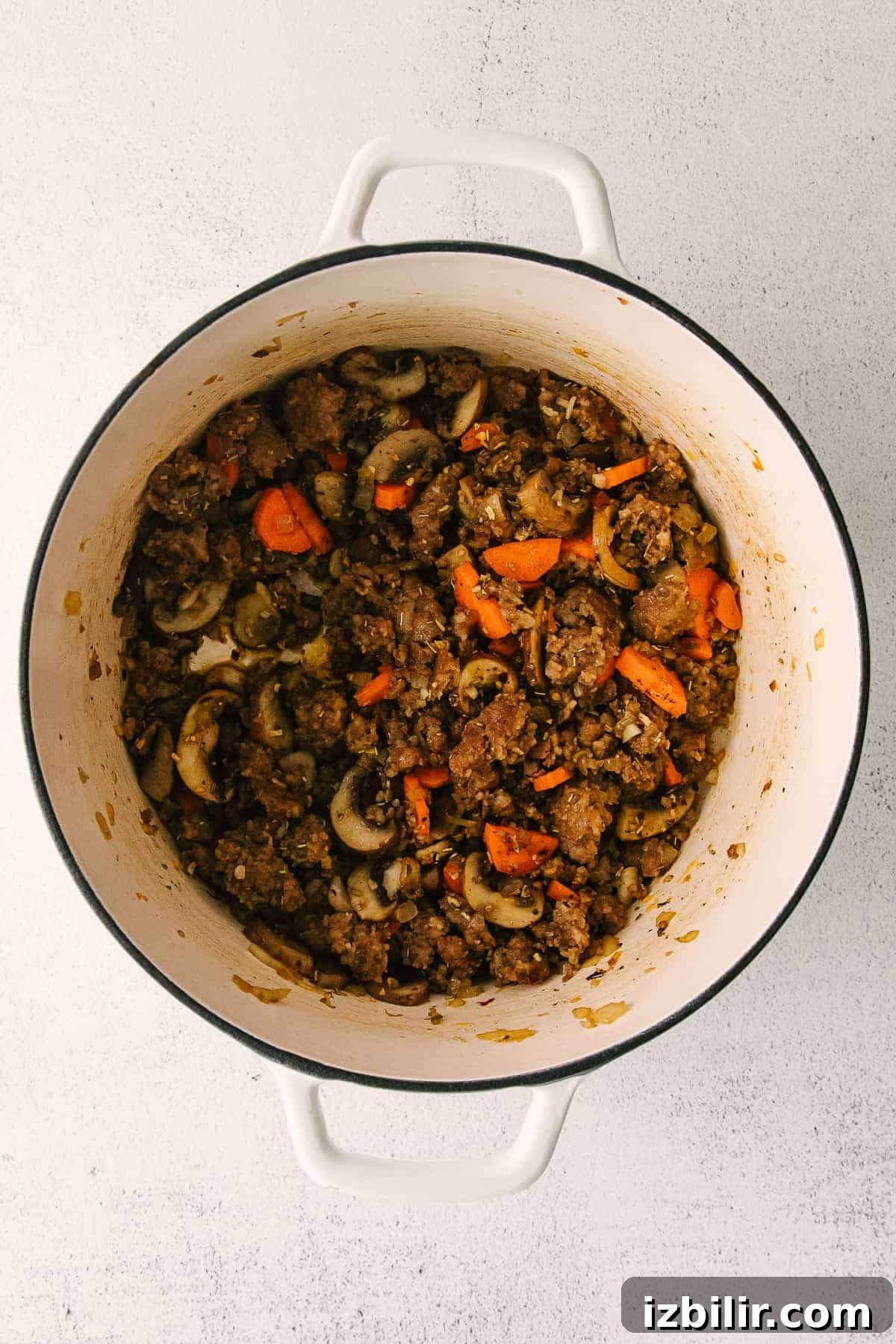 ingredients for sausage gnocchi soup in a stock pot