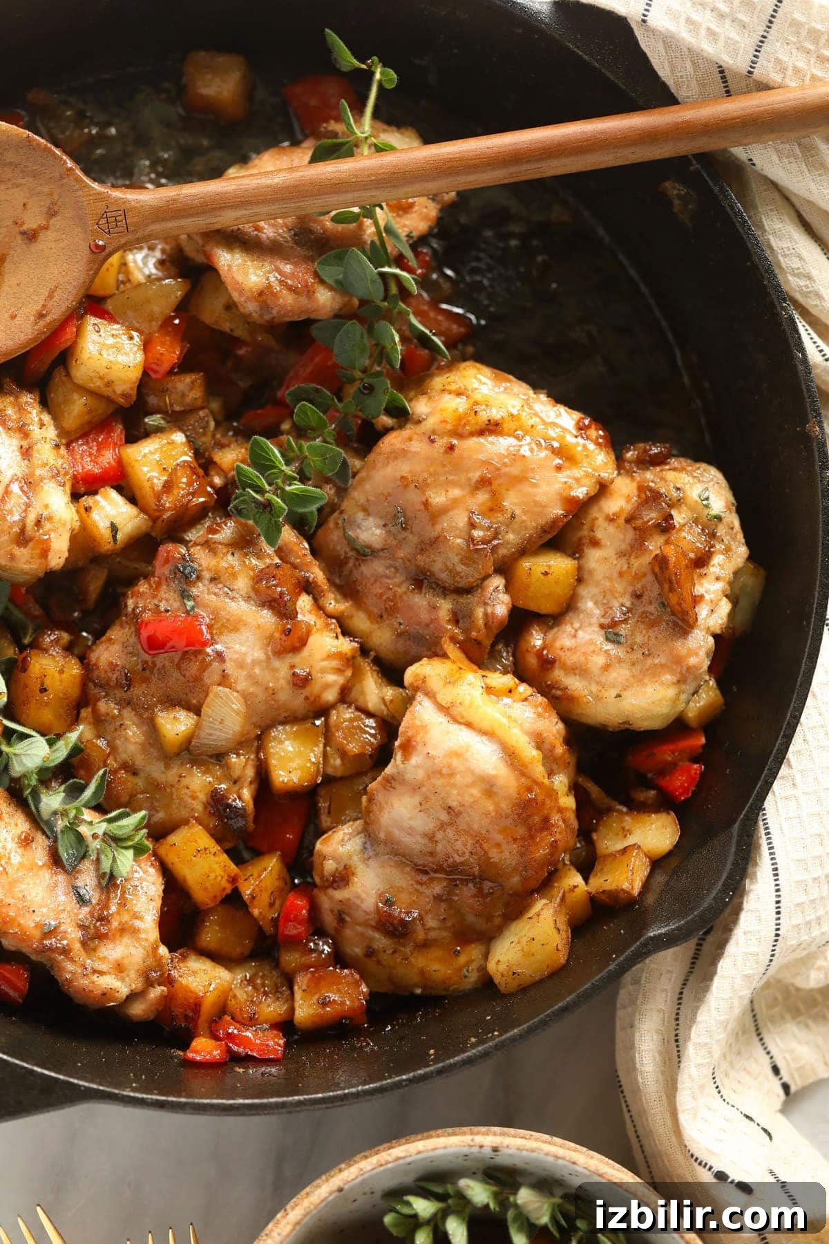 skillet chicken and potatoes looking delicious in a cast iron skillet
