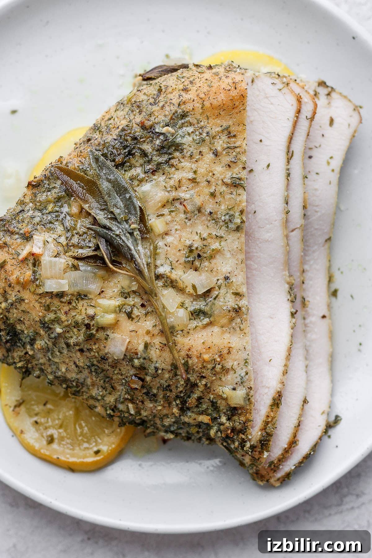 Herb Ranch Roasted Turkey Breast Recipe 2 Sliced turkey breast on a plate.