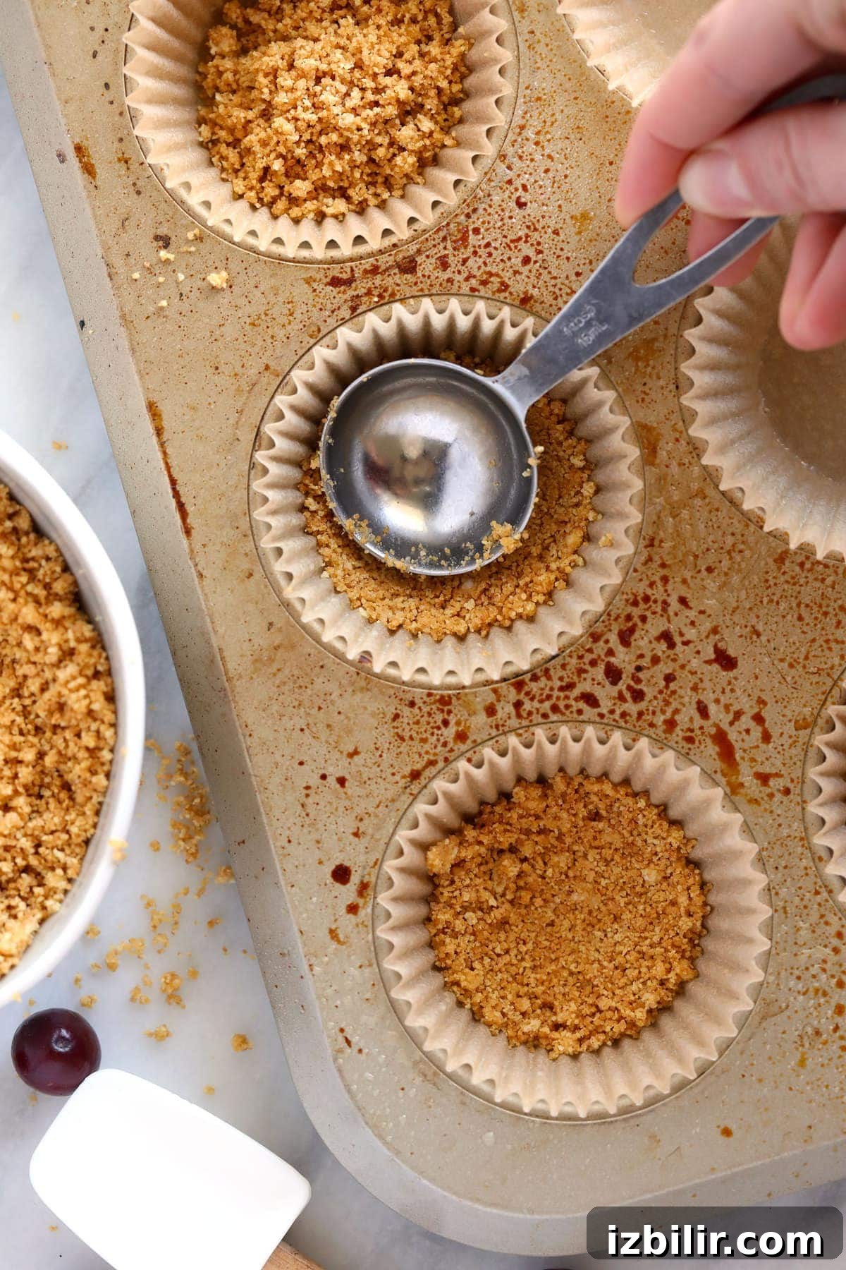 Mini Cranberry Swirl Greek Yogurt Cheesecake Bites Recipe 4 Making crust for the cheesecake bites.