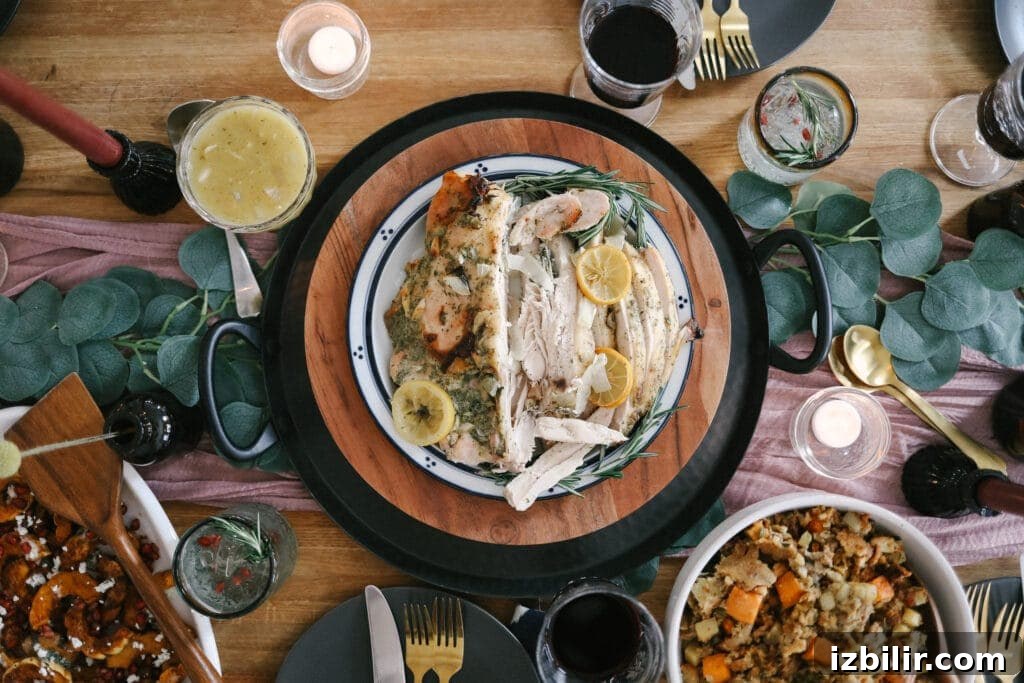 This roasted turkey breast recipe is perfect for a smaller Thanksgiving celebration! It is moist, flavorful, and goes great with any of your favorite Thanksgiving side dishes. ranch turkey breast on table
