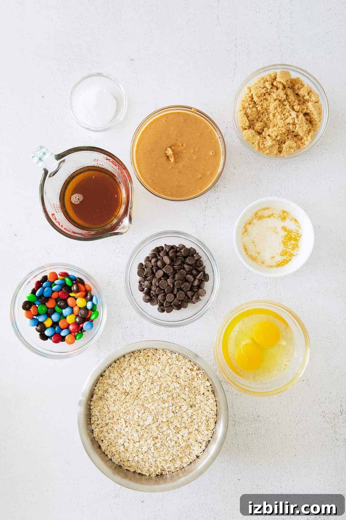 Monster Cookie Bars Recipe: Oats, Peanut Butter & M&Ms 5 Monster cookie bars ingredients on countertop