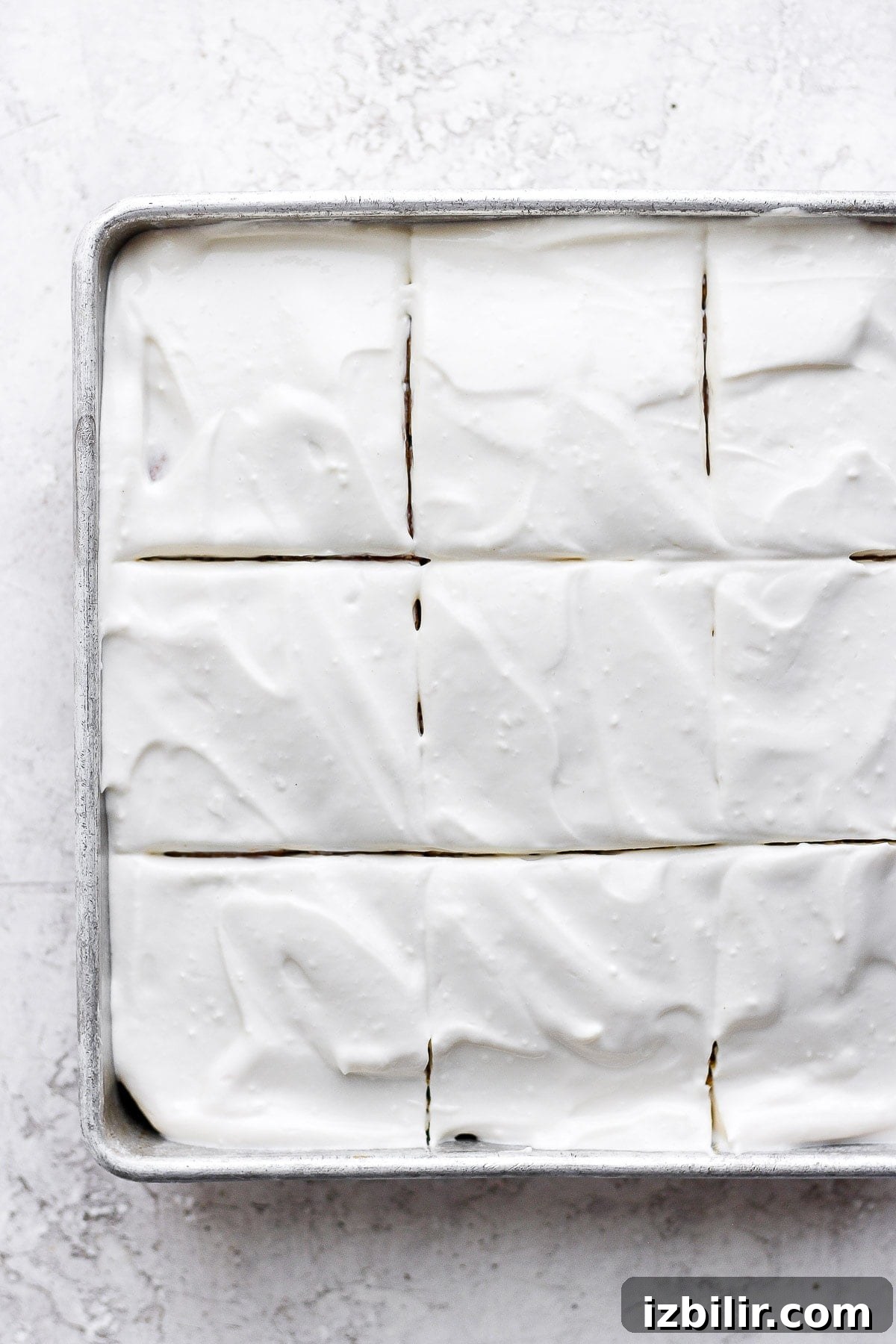 This Greek yogurt cream cheese frosting is the most delicious healthy cream cheese frosting we've ever had! Pumpkin cake sliced with cream cheese frosting.