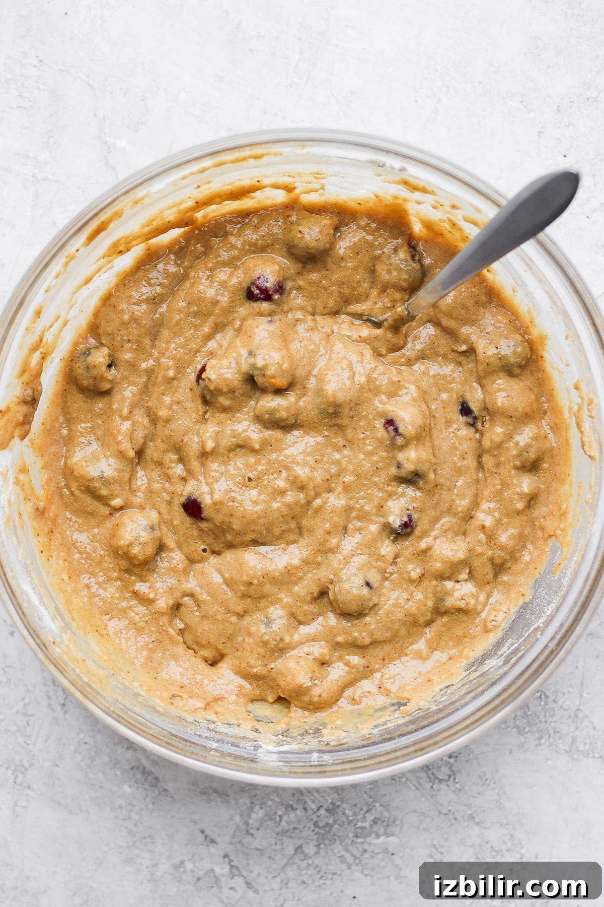 cranberry orange bread batter mixed in a bowl