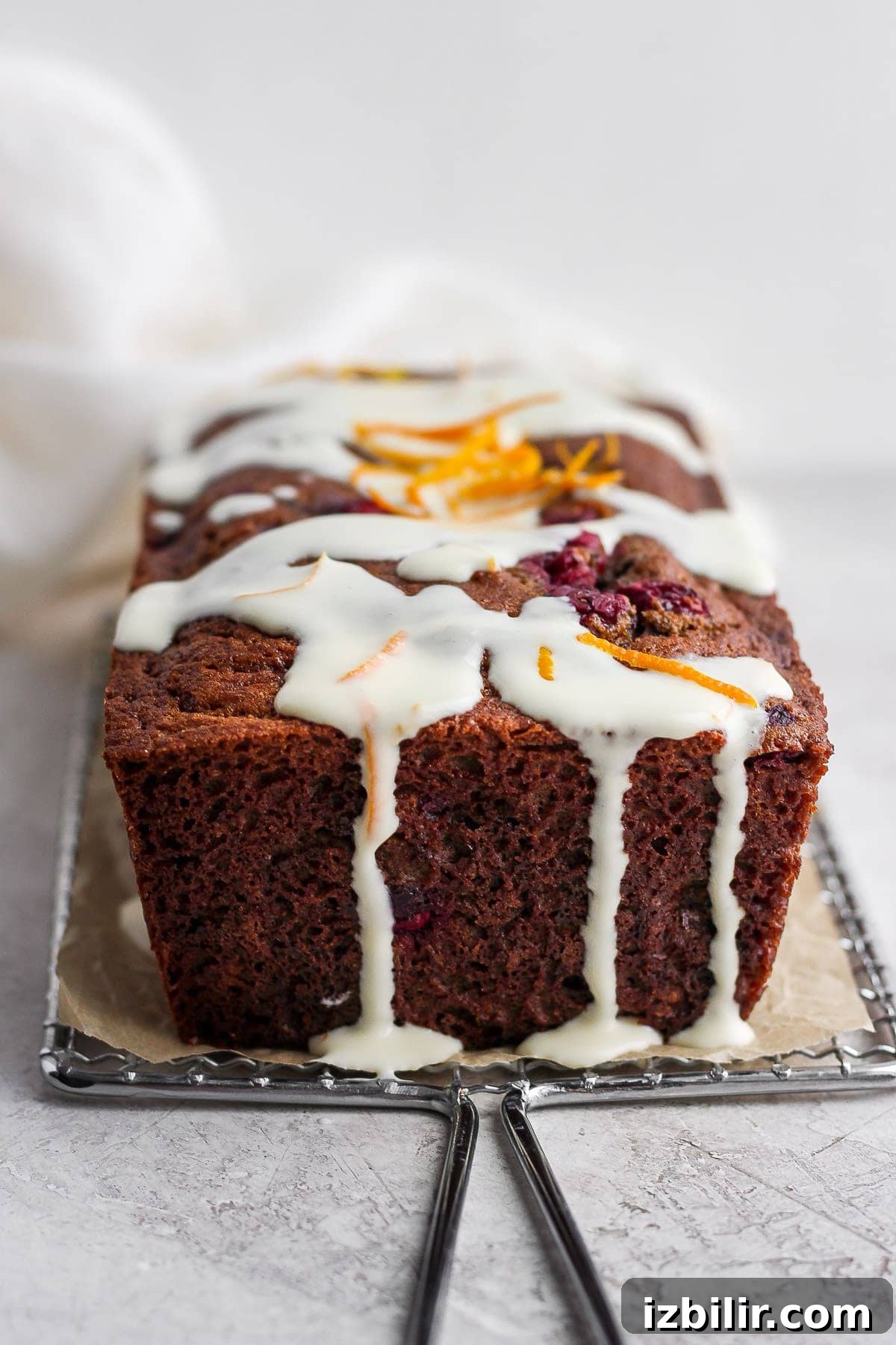 cranberry orange bread with a cream cheese glaze