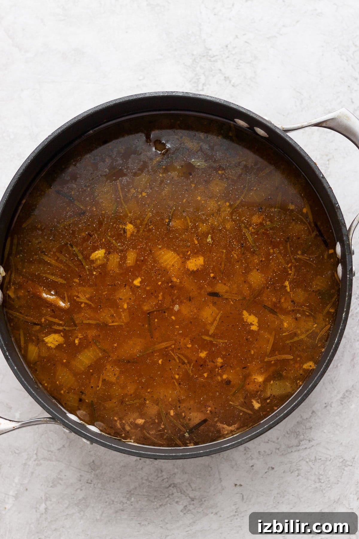 Chicken broth in a pot.