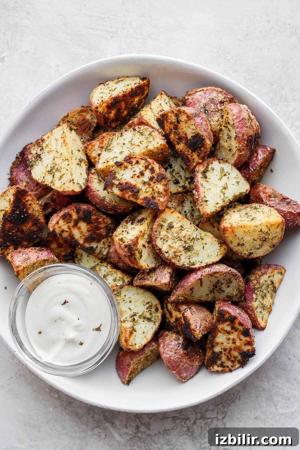 These Ranch Roasted Potatoes are flavor-packed and deliciously crispy! Whip up a batch for the most flavorful side dish. ranch roasted potatoes in a bowl ready to be served