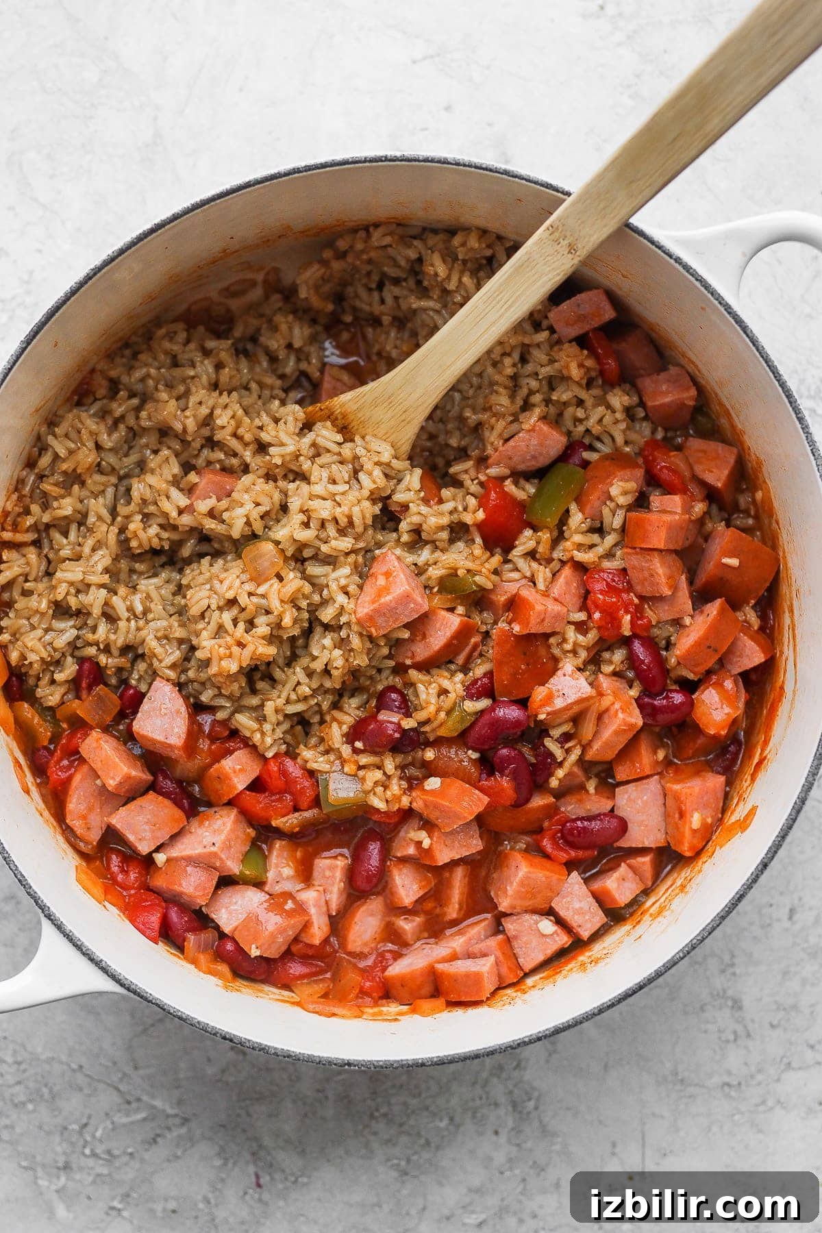 cooked red beans and rice ingredients in a stock pot ready to be mixed