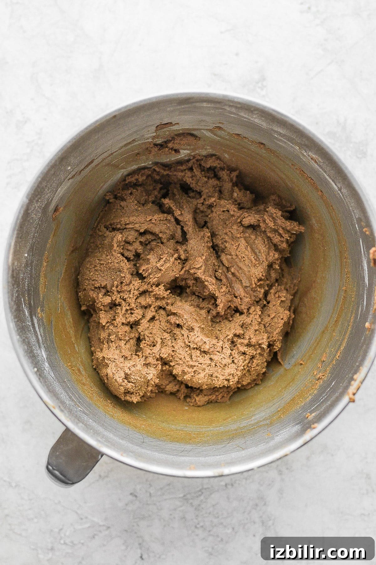 Gingerbread cookie dough in a mixing bowl.