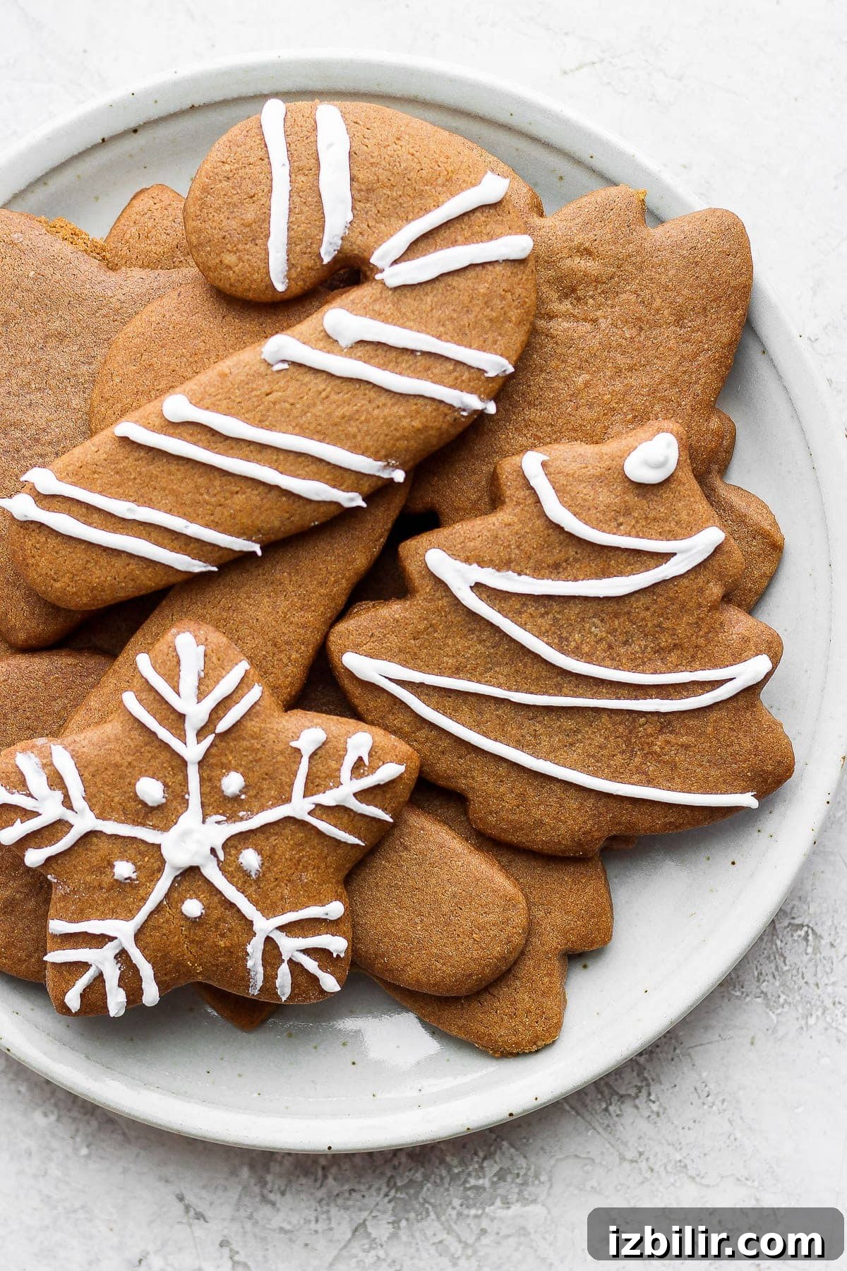 Decorated gingerbread cookies on a plate.