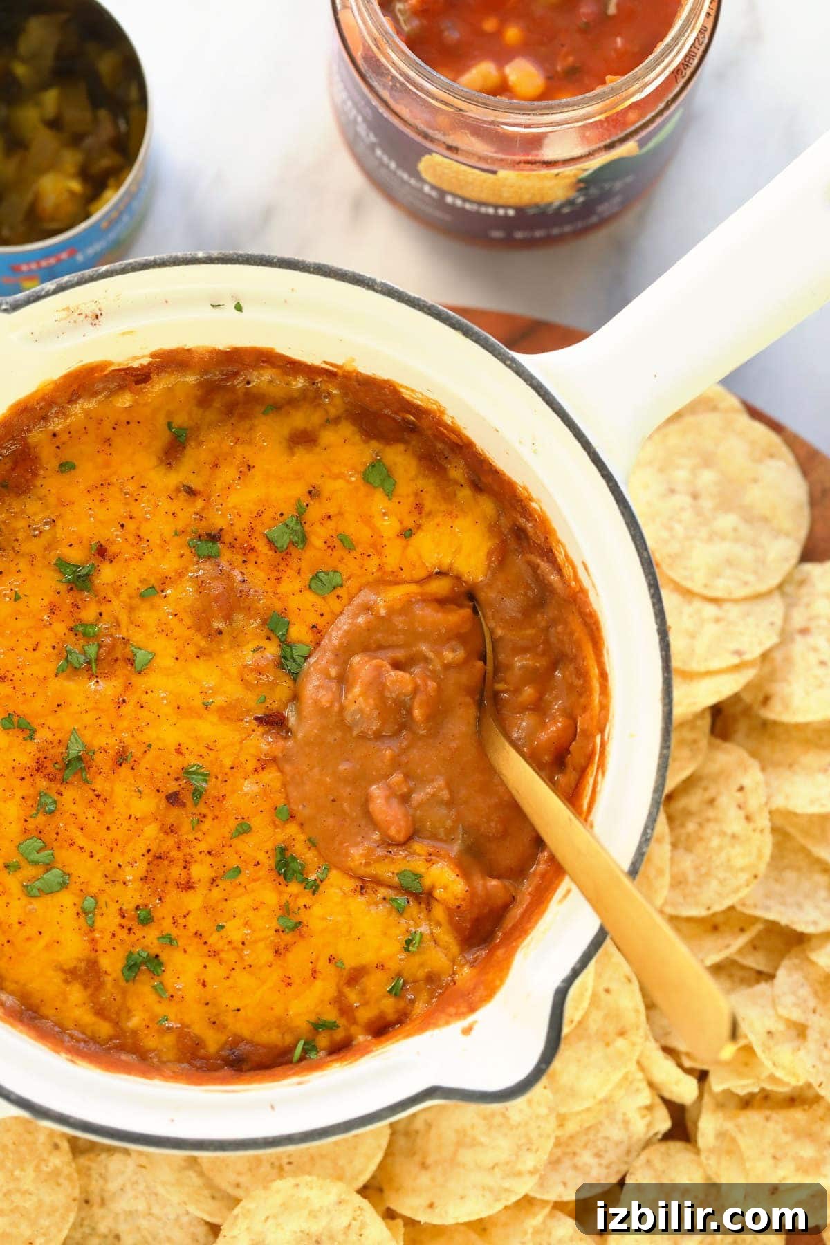 bean dip covered in melted cheese and baked to perfection