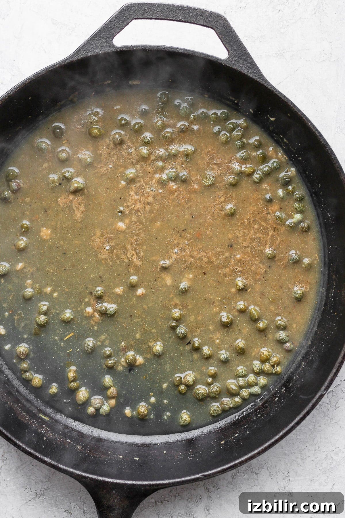 White wine sauce in a cast iron.