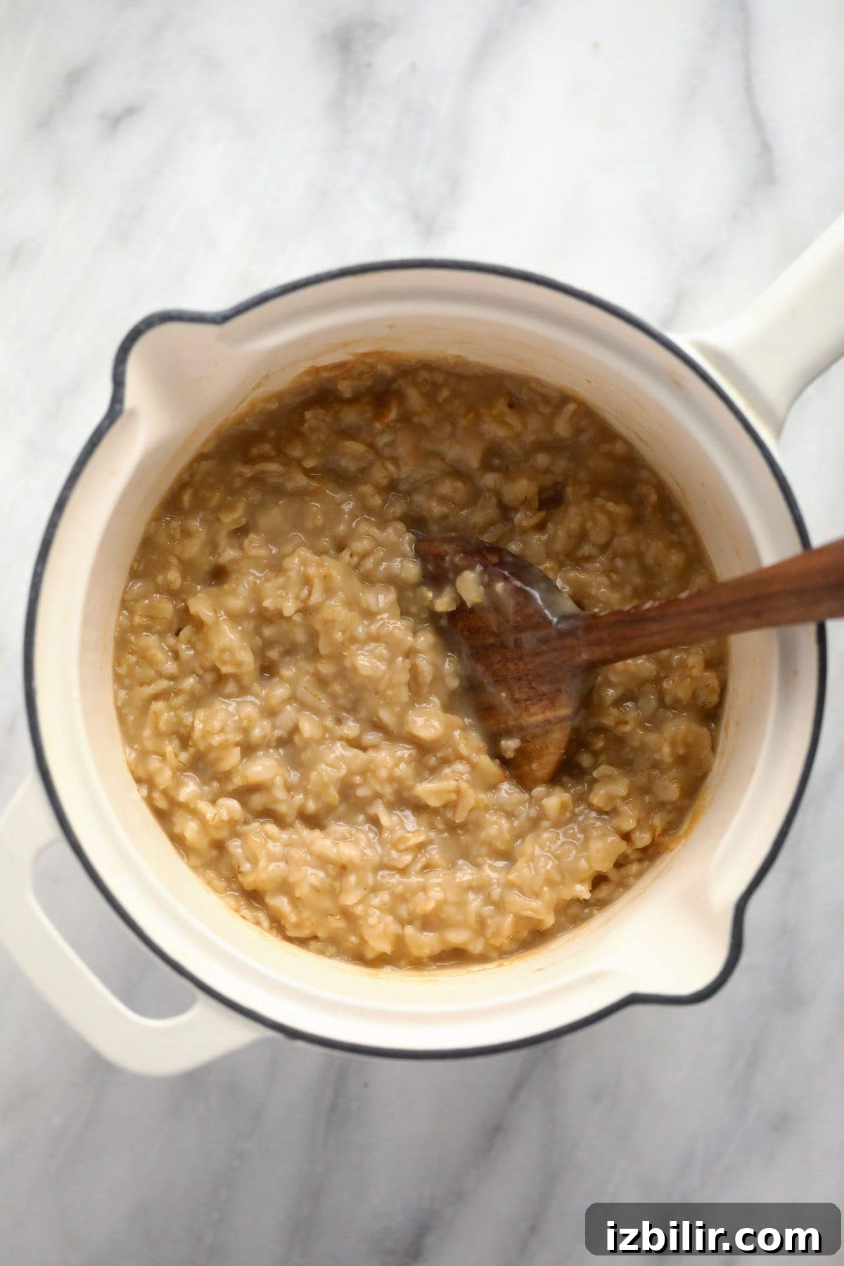 Savory Oatmeal Recipe for a Hearty Breakfast 5 Creamy savory oatmeal in a small pot.