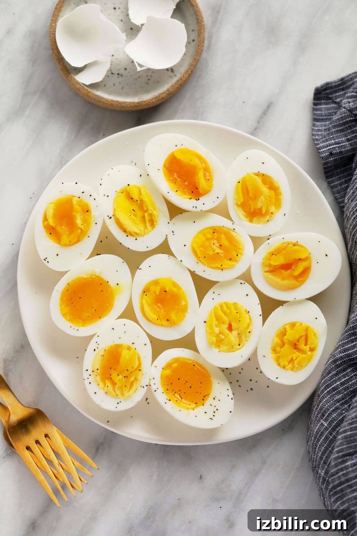 hard boiled eggs on plate with forks