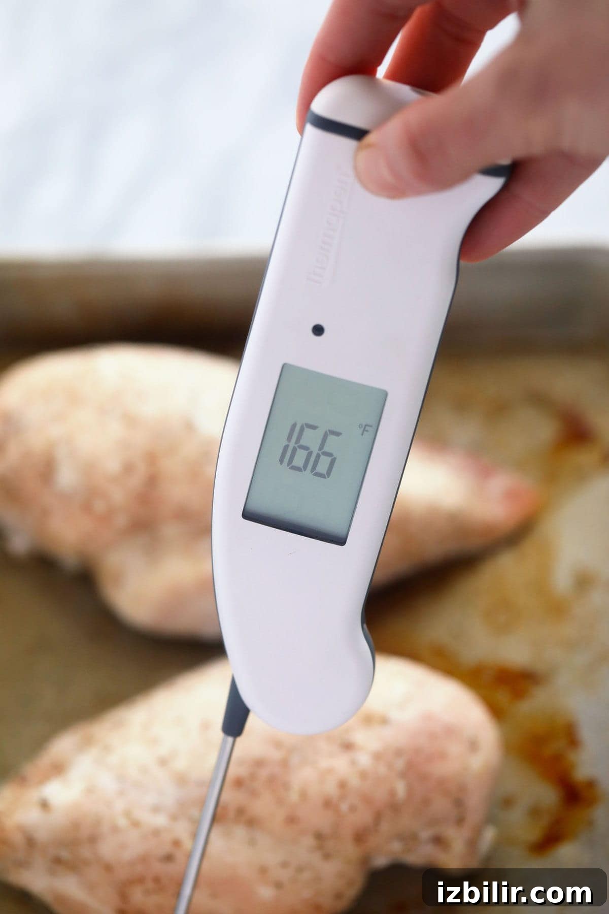 Wondering how to make the easiest shredded chicken? Look no further! This shredded chicken is baked to perfection, and will easily become a meal-prep staple in your home. thermometer in a chicken breast to determine internal temperature