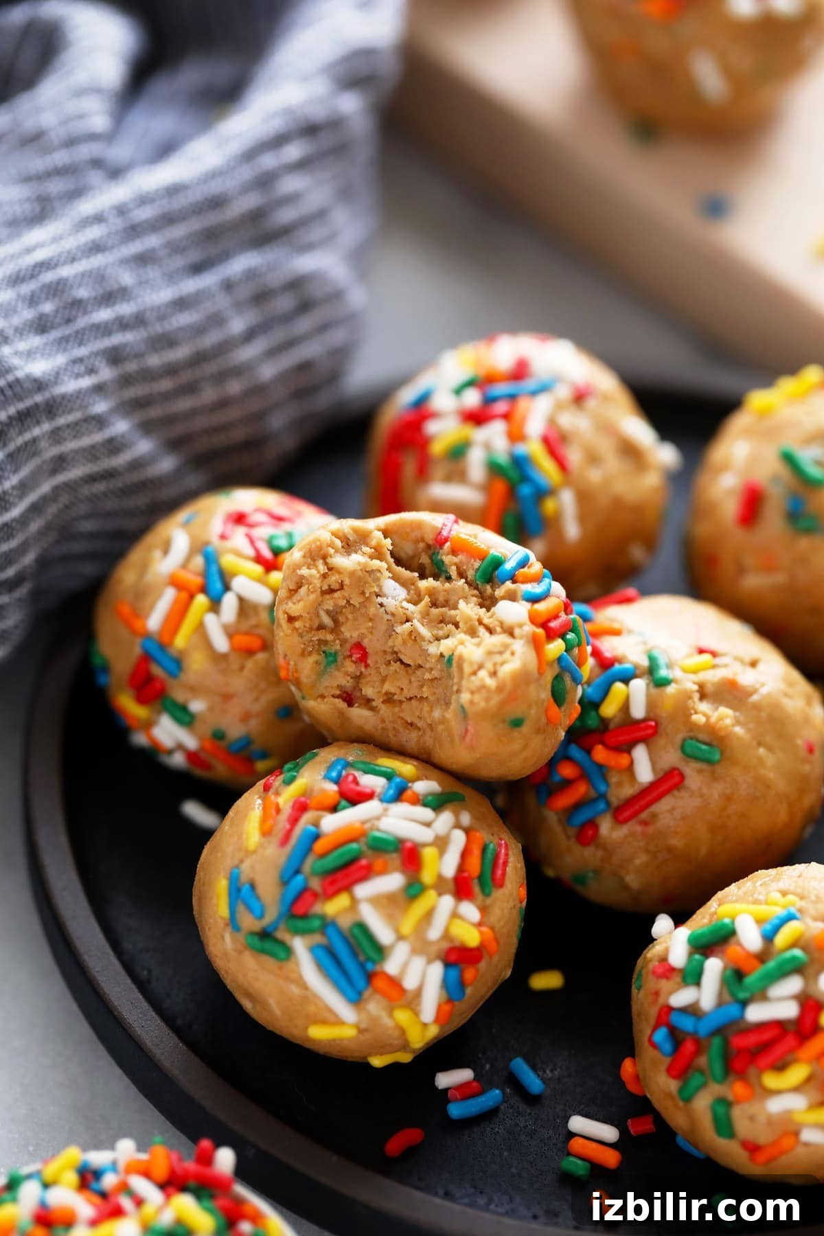 cake batter protein balls with a bite taken out of them